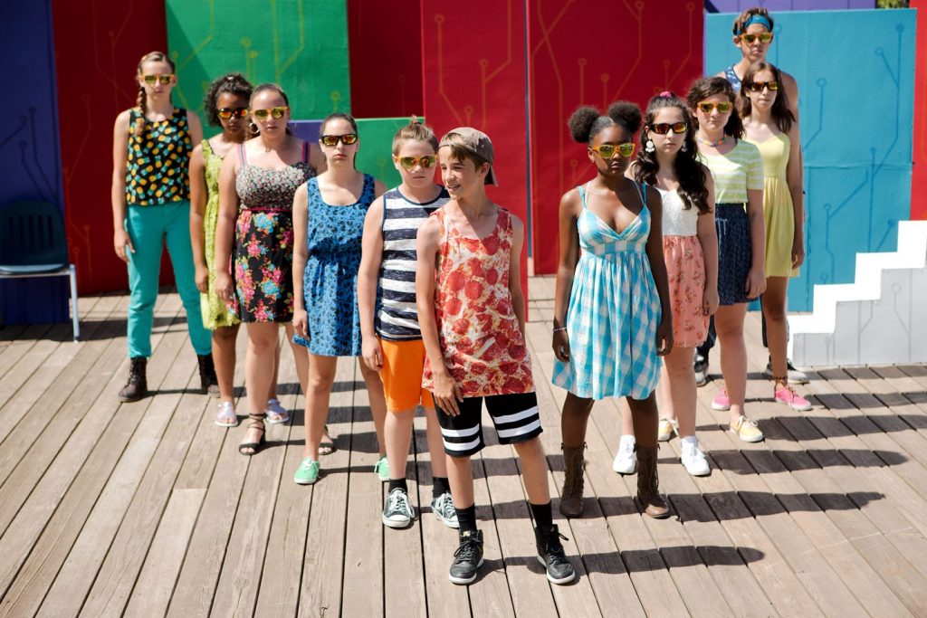 Campers on stage in the amphitheater.